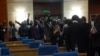 Lawmakers from the opposition MCP walk out of the parliament in protest. (L. Masina/VOA)