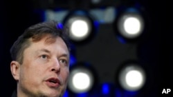 FILE - Elon Musk speaks at the SATELLITE Conference and Exhibition in Washington on March 9, 2020.