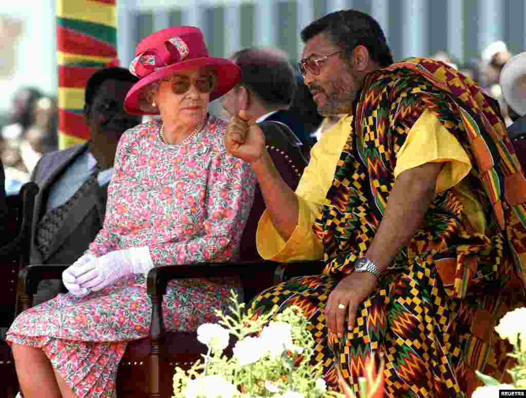 Queen Elizabeth II chats with Ghana's President Flight Lieutenant Jerry Rawlings, November 8,1999 during the second day of her official state visit to the country. Earlier in the day the Queen had stepped into controversy when she praised Jerry Rawlings in a speech to parliament.