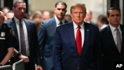 Former President Donald Trump arrives at Manhattan criminal court, Feb. 15, 2024, in New York. 