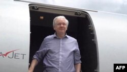 WikiLeaks founder Julian Assange steps off his flight from London upon arriving in Bangkok for a layover at Don Mueang International Airport in the Thai capital, in this screen shot courtesy of the WikiLeaks X account, June 25, 2024.