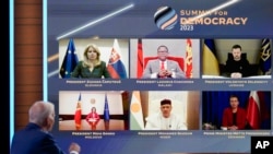FILE - World leaders attend virtually as President Joe Biden speaks during a Summit for Democracy virtual plenary in the South Court Auditorium on the White House campus, in Washington, March 29, 2023.