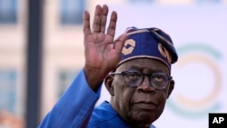 FILE - Nigeria's President Bola Tinubu arrives for the closing session of the New Global Financial Pact Summit, on June 23, 2023, in Paris.
