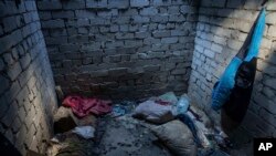 Debris lies on the floor of a building used by Russian forces where civilians said they were held and tortured, in Izium, Ukraine, Sept. 21, 2022.