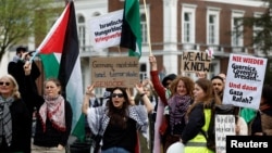 People demonstrate outside the Peace Palace in The Hague, Netherlands, in support of Palestinians on the day Nicaragua asked the International Court of Justice to order Berlin to halt military arms exports to Israel, April 8, 2024. 