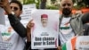 FILE - Demonstrators gather in front of the Embassy of Niger in Paris, in support of Nigerien President Mohamed Bazoum, Aug. 5, 2023.
