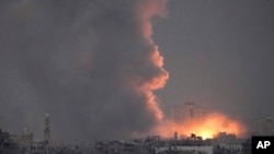 Smoke rises following an Israeli airstrike in the Gaza Strip, as seen from southern Israel, Oct. 14, 2023. 