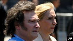 FILE - Javier Milei and his sister, Karina, arrive at the government house in Buenos Aires on Dec. 10, 2023, after he was sworn in as Argentina's president. Under Milei's leadership, Argentina announced on December 29 that it will not join the BRICS group of nations.