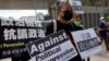 Hong Kong Police Arrest Union Leader Following Visit to Imprisoned Husband