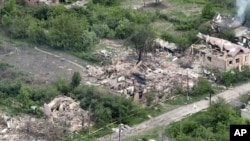 his drone footage obtained by The Associated Press shows the village of Ocheretyne, a target for Russian forces in the Donetsk region of eastern Ukraine. Ocheretyne had a population of about 3,000 before the war.