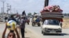 Displaced Palestinians who left with their belongings from Rafah in the southern Gaza Strip following an evacuation order by the Israeli army, arrive to Khan Yunis on May 6, 2024.