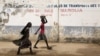 FILE - Girls walk on a road in Maroua, Cameroon, March 17, 2016. Cameroon’s government says 70% of menstruating women and girls lack access to regular basic sanitation products. 
