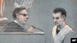 FILE - Massachusetts Air National Guardsman Jack Teixeira, right, appears in U.S. District Court in Boston, April 14, 2023.