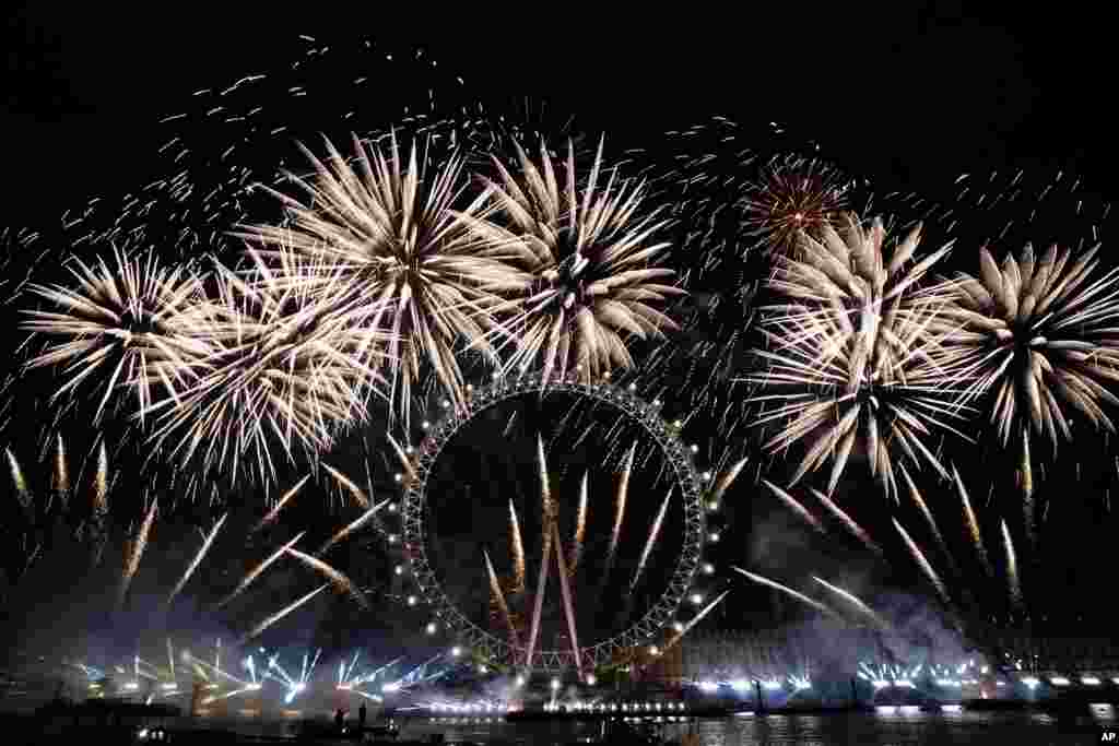 Fireworks light-up the sky over the London Eye in central London to celebrate the New Year, Jan. 1, 2024.