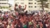 This video grab shows soldiers holding General Brice Clothaire Oligui Nguema aloft in Libreville, Gabon, Aug. 30, 2023. The general, chief of the Republican Guard, was designated president of the transitional committee. (Gabon24 via AP)