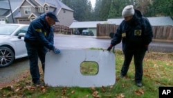 This photo released by the National Transportation Safety Board shows the door plug from Alaska Airlines Flight 1282, in Portland, Oregon, Jan. 8, 2024.