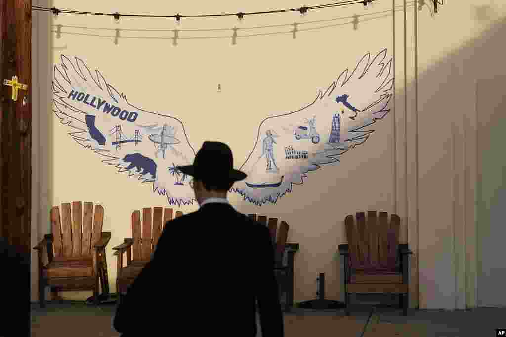 A man walks to his synagogue in Los Angeles before sunset on Oct. 7, 2023.