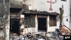 A burnt church is seen on the outskirts of Faisalabad, Pakistan, Aug. 16, 2023, following an attack by Muslim men after a Christian family was accused of blasphemy. 