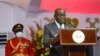 Rais wa Ghana Nana Akufo-Addo (wapili kulia) akihutubia baada ya kuapishwa katika Ikulu ya Ghana. Picha na Nipah Dennis / AFP.