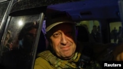 FILE — Yevgeny Prigozhin leaves the headquarters of the Southern Military District amid the Wagner Group's pullout from the city of Rostov-on-Don, Russia, June 24, 2023.