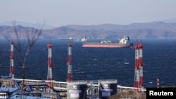 FILE - A crude oil tanker lies at anchor near the terminal Kozmino in Nakhodka Bay near the port city of Nakhodka, Russia, Dec. 4, 2022. 