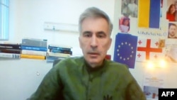 FILE - Georgia's jailed ex-President Mikheil Saakashvili appears via video link during a court hearing regarding anti-government protests in 2007, in Tbilisi, Oct. 27, 2023. 