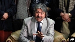 FILE - General Abdul Rashid Dostum speaks during a press conference at the airport in Kabul, Afghanistan, Friday, Jan. 13, 2012. 