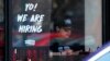 FILE - A hiring sign is displayed at a restaurant in Schaumburg, Ill., April 1, 2022. 