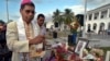 FILE - East Timor's Roman Catholic Bishop and Nobel Prize laureate Carlos Ximenes Belo prays in a ceremony to pay last respects to the former head of the UN Transition Authority in East Timor, Sergio Vieira De Mello in Dili, on Aug. 23, 2003.