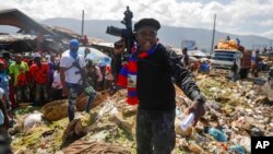 FILE - Jimmy Cherizier, known as Barbecue, the leader of the G9 and Family gang, in Port-au-Prince, Haiti, Oct. 22, 2021. Cherizier is among those targeted by U.N. sanctions in an effort to quell gang violence in Haiti.