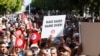 FILE - Protesters rally against Tunisian President Kais Saied, in Tunis, Oct. 15, 2022.