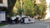 This photo taken by an individual not employed by the AP and obtained outside Iran shows students of the Sharif University of Technology at a protest sparked by the death in September of 22-year-old Mahsa Amini in the custody of police, in Tehran, Oct. 7,