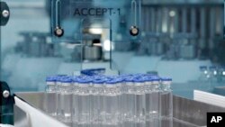 FILE: In this image provided by the Serum Institute of India, vials of freshly manufactured Novavax COVID-19 vaccines wait to be labeled in 2022, in Pune, India. 