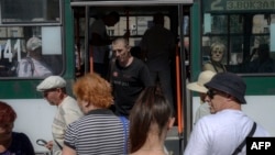 A man walks out of a bus in Mykolaiv, Ukraine, on July 21, 2022, amid the Russian invasion of Ukraine.
