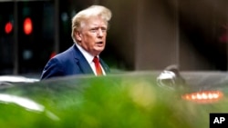 FILE - Former President Donald Trump departs Trump Tower, Aug. 10, 2022, in New York, on his way to the New York attorney general's office for a deposition in a civil investigation.