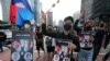 FILE - Myanmar nationals living in South Korea march to condemn Myanmar's recent executions of activists, at the down town in Seoul, South Korea, Saturday, July 30, 2022.