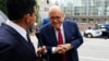 FILE - Rudy Giuliani, former U.S. President Donald Trump's personal lawyer, arrives at a courthouse to face a special grand jury regarding a probe into the 2020 election in Atlanta, Aug. 17, 2022.