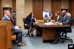 FILE - Fulton County prosecutor Fani Willis, center, and her team, during proceedings to seat a special purpose grand jury in Fulton County, Georgia, on May 2, 2022, to look into the actions of former President Donald Trump and his supporters.