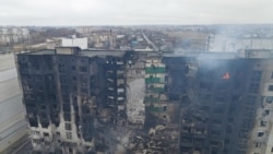 An aerial view shows a residential building destroyed by shelling, as Russia's invasion of Ukraine continues, in the settlement of Borodyanka in the Kyiv region, Ukraine March 3, 2022. Picture taken with a drone.