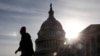 A visitor walks by the U.S. Capitol during a partial government shutdown in Washington, Jan. 22, 2019.