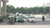 Grab competes with traditional taxis in Vietnam. (H. Nguyen/VOA)