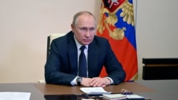 FILE - Russian President Vladimir Putin chairs a meeting with members of the Security Council via a video link at the Novo-Ogaryovo state residence outside Moscow, Russia March 3, 2022.