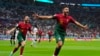 Portugal's Goncalo Ramos, right, celebrates after scoring during the World Cup round of 16 soccer match between Portugal and Switzerland, at the Lusail Stadium in Lusail, Qatar, Dec. 6, 2022. 