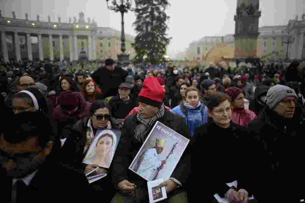 People attend the funeral of late Pope Emeritus Benedict XVI in St. Peter's Square at the Vatican, Jan. 5, 2023.