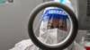 A health worker waits for people to take swab samples to test for COVID-19 in the Jing'an district in Shanghai on Dec. 23, 2022.