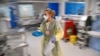 FILE - A nurse treats COVID-19 patients in the Intensive Care Unit at Milton Keynes University Hospital in Britain, Jan. 20, 2021. 