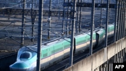 This picture shows a derailed Shinkansen bullet train in Shiroishi, Miyagi prefecture on March 17, 2022.