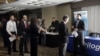 Job seekers line up at a job fair in Boston. While overall unemployment for Asian-Americans remains below the national average, their rate of long-term unemployment is the highest. 
