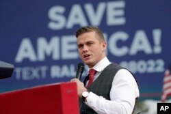 FILE - Rep. Madison Cawthorn, R-N.C., speaks before former President Donald Trump takes the stage at a rally in Selma, N.C., April 9, 2022.