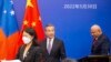 China's Foreign Minister Wang Yi, center, appears on stage at the Pacific Islands Foreign Ministers' meeting with Fiji's Prime Minister Frank Bainimarama, May 30, 2022, in Suva, Fiji.